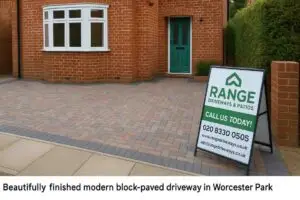 Finished driveway with Range Driveways & Patios branding on signboard.